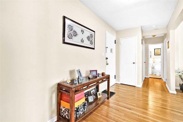 209-10 41st Ave Unit 2J, Bayside, NY 11361 - hall with light wood-style floors and baseboards