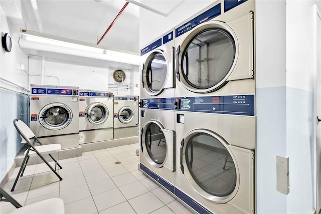209-10 41st Ave Unit 2J, Bayside, NY 11361 - community laundry room with stacked washer and clothes dryer, tile patterned floors, and washing machine and dryer