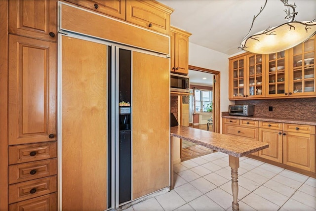 162-41 Powells Cove Blvd Unit 4D, Beechhurst, NY 11357 - kitchen with paneled fridge, tasteful backsplash, glass insert cabinets, stainless steel microwave, and light tile patterned flooring