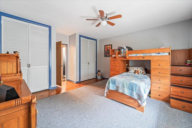 162-41 Powells Cove Blvd Unit 4D, Beechhurst, NY 11357 - carpeted bedroom featuring multiple closets, a ceiling fan, and wood finished floors