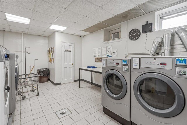 162-41 Powells Cove Blvd Unit 4D, Beechhurst, NY 11357 - communal laundry room featuring washing machine and dryer and light tile patterned floors