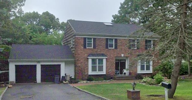 2 Evans Ln, Farmingville, NY 11738 - colonial-style house with a garage, asphalt driveway, and a front lawn