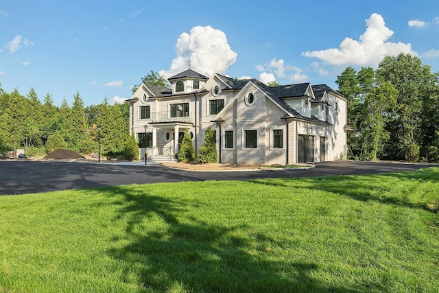 26 Saint Andrews Ct, Old Westbury, NY 11568 - french country style house with driveway and a front lawn