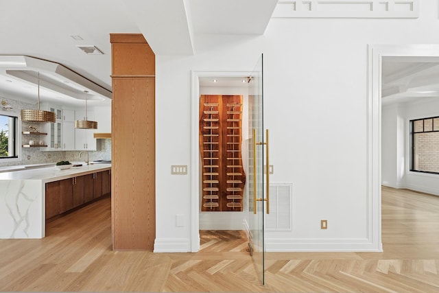 26 Saint Andrews Ct, Old Westbury, NY 11568 - wine cellar featuring a sink and parquet floors