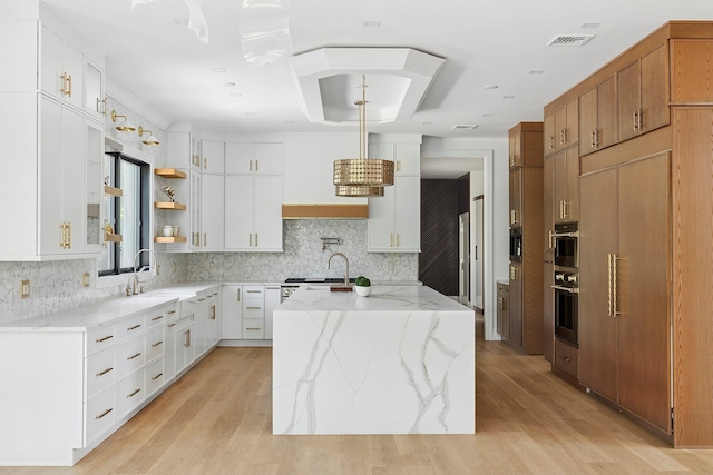 26 Saint Andrews Ct, Old Westbury, NY 11568 - kitchen with stove, decorative backsplash, open shelves, and light wood-type flooring