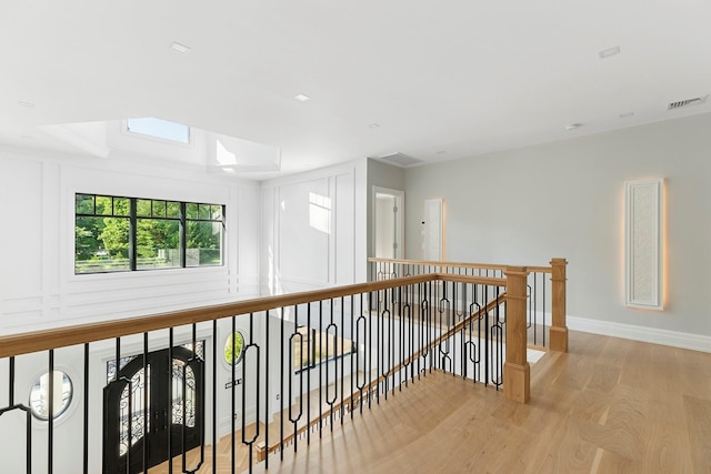 26 Saint Andrews Ct, Old Westbury, NY 11568 - hall with an upstairs landing and wood finished floors