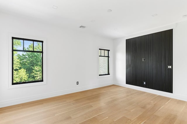 26 Saint Andrews Ct, Old Westbury, NY 11568 - unfurnished bedroom featuring light wood-style floors and baseboards