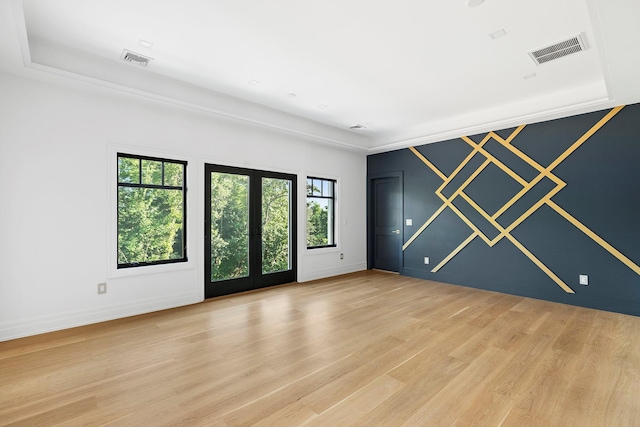 26 Saint Andrews Ct, Old Westbury, NY 11568 - unfurnished room with light wood-style flooring and french doors