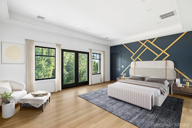 26 Saint Andrews Ct, Old Westbury, NY 11568 - bedroom featuring wood finished floors and french doors