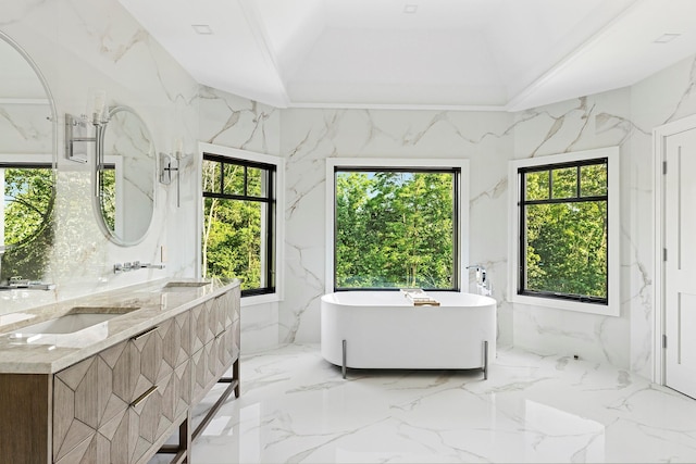 26 Saint Andrews Ct, Old Westbury, NY 11568 - full bathroom with marble tiled flooring, a freestanding tub, double vanity, and healthy amount of natural light