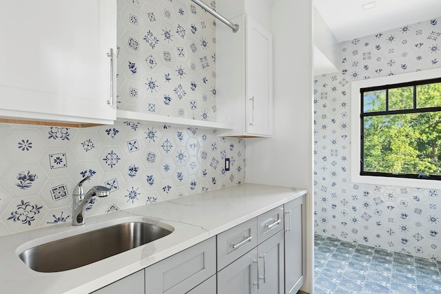 26 Saint Andrews Ct, Old Westbury, NY 11568 - kitchen featuring decorative backsplash, light stone countertops, and gray cabinetry