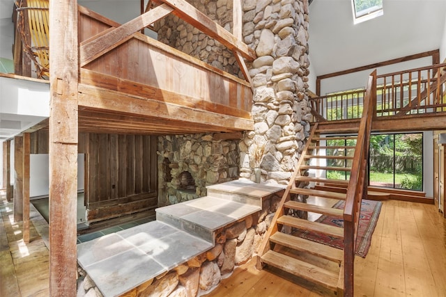 880 W Mill Rd, Mattituck, NY 11952 - staircase featuring hardwood / wood-style floors and a towering ceiling