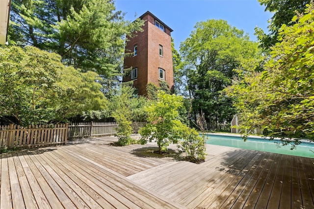 880 W Mill Rd, Mattituck, NY 11952 - wooden terrace with a fenced backyard and view of wooded area