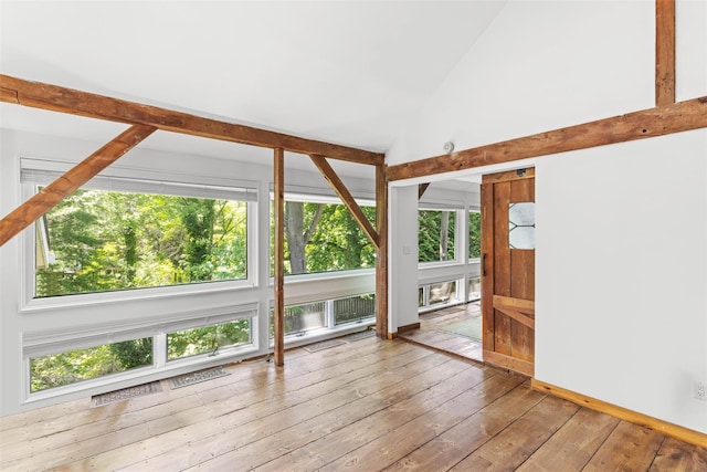 880 W Mill Rd, Mattituck, NY 11952 - spare room featuring plenty of natural light, hardwood / wood-style flooring, and high vaulted ceiling