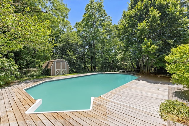 880 W Mill Rd, Mattituck, NY 11952 - swimming pool featuring a shed, a deck, and view of scattered trees