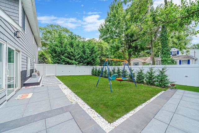 5 Pickett Ct, Malverne, NY 11565 - fenced backyard with a playground and a patio