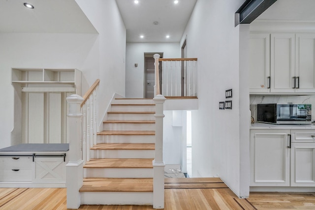 5 Pickett Ct, Malverne, NY 11565 - stairs featuring wood finished floors and recessed lighting