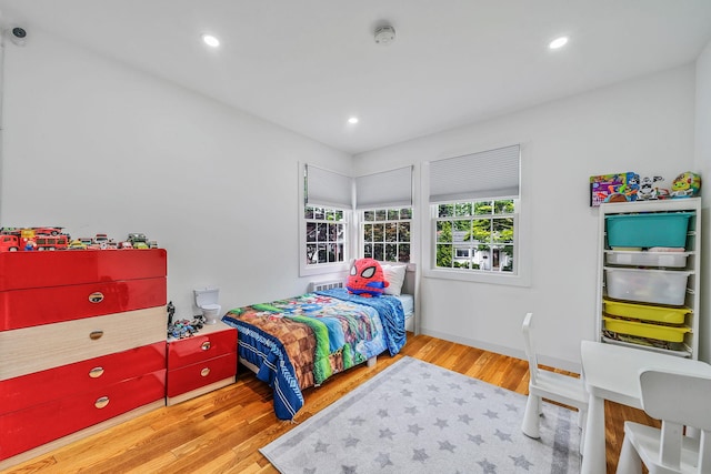 5 Pickett Ct, Malverne, NY 11565 - bedroom with wood finished floors and recessed lighting