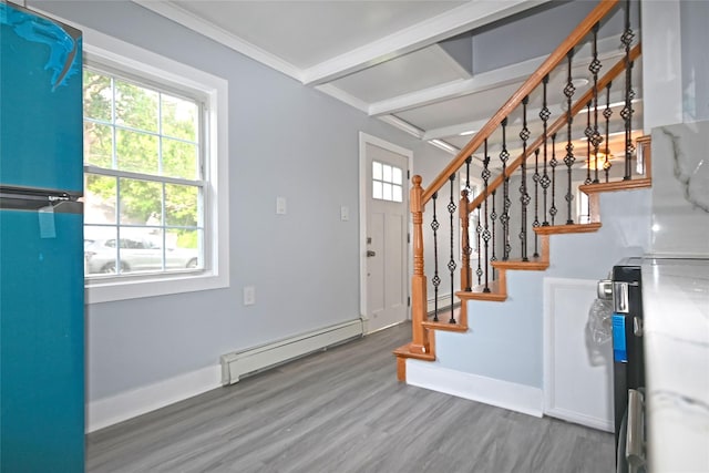 67 Maplewood Dr, Westbury, NY 11590 - foyer entrance featuring plenty of natural light, a baseboard heating unit, wood finished floors, stairway, and beam ceiling