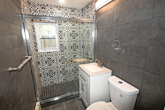 67 Maplewood Dr, Westbury, NY 11590 - bathroom with vanity, a tile shower, tile walls, a baseboard heating unit, and tile patterned flooring