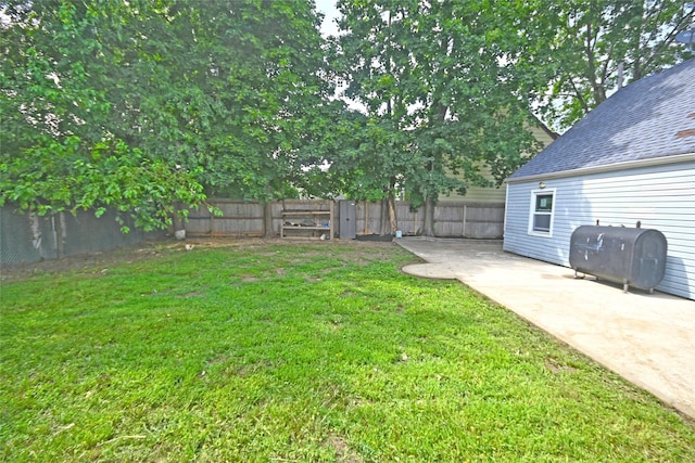 67 Maplewood Dr, Westbury, NY 11590 - fenced backyard with heating fuel and a patio