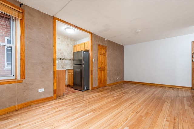 33-35 81st St Unit 4A, Jackson Heights, NY 11372 - spare room with light wood-type flooring and baseboards