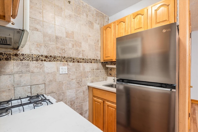 33-35 81st St Unit 4A, Jackson Heights, NY 11372 - kitchen with freestanding refrigerator, light countertops, and tile walls