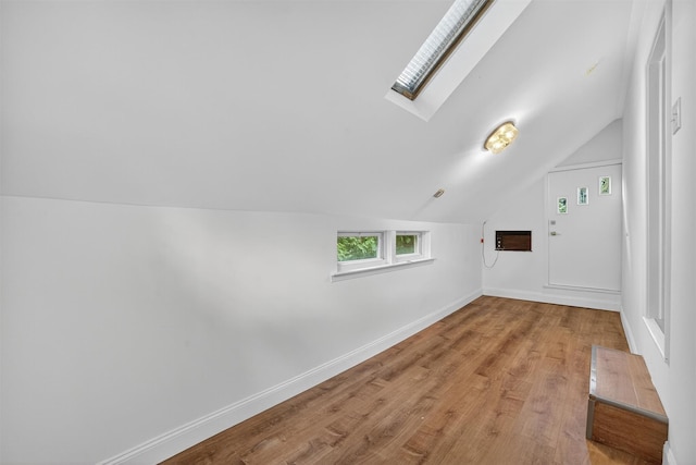 15 Benedict Ave, Eastchester, NY 10709 - additional living space with vaulted ceiling, a skylight, and wood finished floors