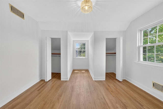 15 Benedict Ave, Eastchester, NY 10709 - unfurnished bedroom featuring light wood-style flooring and multiple closets