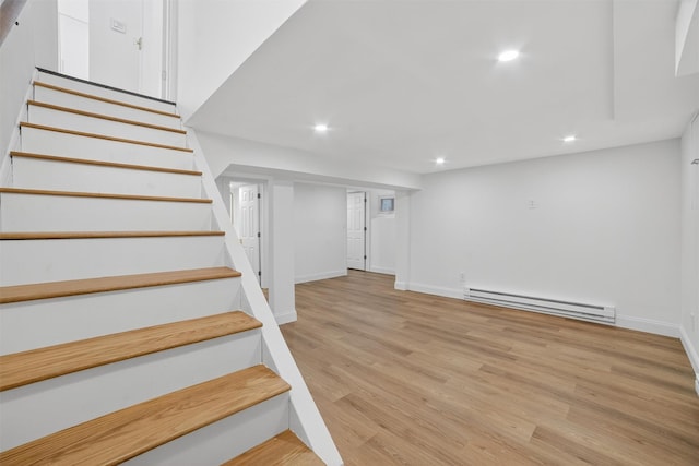 15 Benedict Ave, Eastchester, NY 10709 - stairway with a baseboard radiator, recessed lighting, and wood finished floors