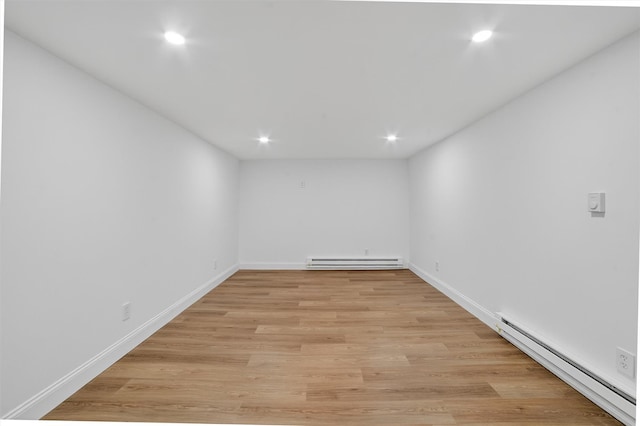 15 Benedict Ave, Eastchester, NY 10709 - unfurnished room featuring baseboard heating, recessed lighting, and light wood-type flooring