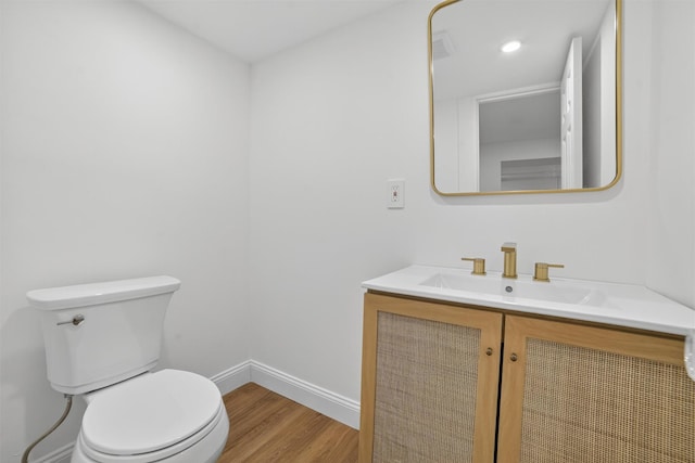 15 Benedict Ave, Eastchester, NY 10709 - half bathroom featuring wood finished floors, vanity, and recessed lighting
