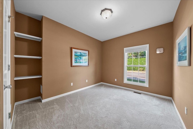 13 Nicole Ct, Copiague, NY 11726 - spare room featuring carpet floors