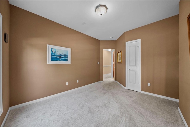 13 Nicole Ct, Copiague, NY 11726 - unfurnished bedroom featuring carpet floors and lofted ceiling