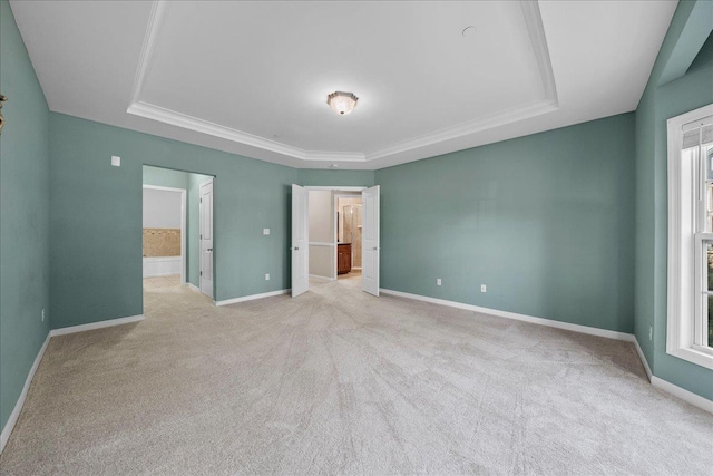 13 Nicole Ct, Copiague, NY 11726 - unfurnished room featuring a tray ceiling, light colored carpet, and ornamental molding