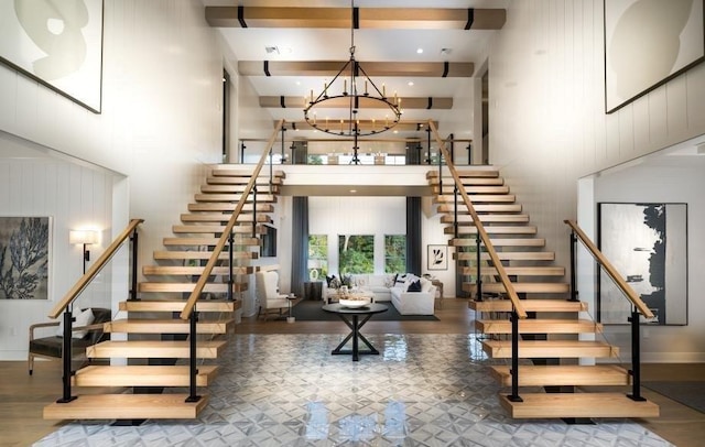 22 Sienna Ct, Dix Hills, NY 11746 - stairs featuring a towering ceiling, a chandelier, and beam ceiling