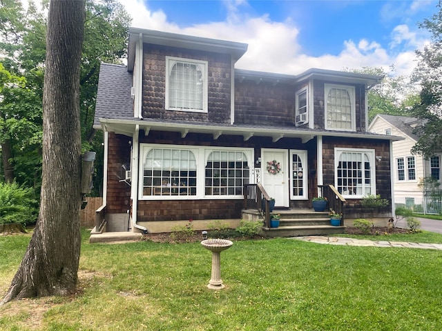 1144 N Ave, New Rochelle, NY 10804 - view of front of property with a front lawn and a shingled roof