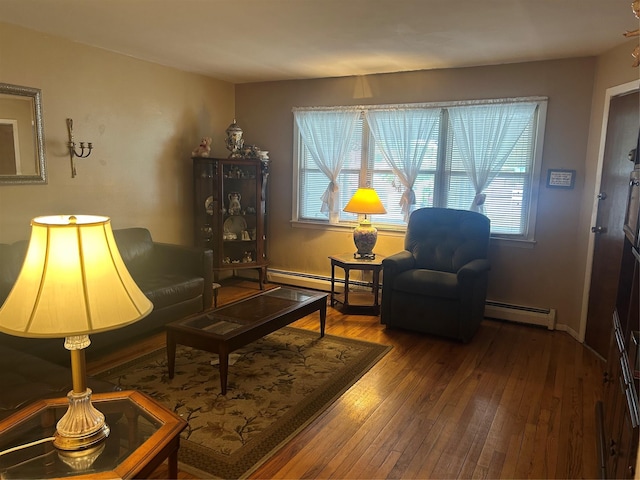 1569 11th St, West Babylon, NY 11704 - sitting room with healthy amount of natural light, hardwood / wood-style floors, and a baseboard heating unit