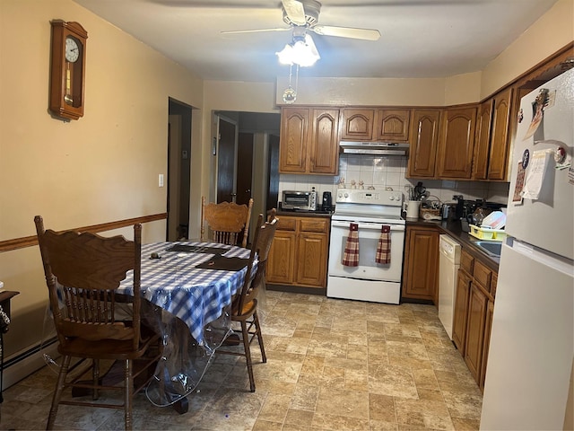 1569 11th St, West Babylon, NY 11704 - kitchen with white appliances, under cabinet range hood, a ceiling fan, backsplash, and light stone finish flooring