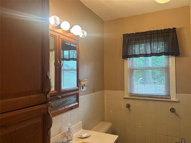 1569 11th St, West Babylon, NY 11704 - bathroom with tile walls, vanity, and a wainscoted wall