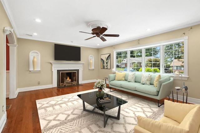 2 Ann Pl, Valhalla, NY 10595 - living area with ceiling fan, wood finished floors, a fireplace with flush hearth, ornamental molding, and recessed lighting