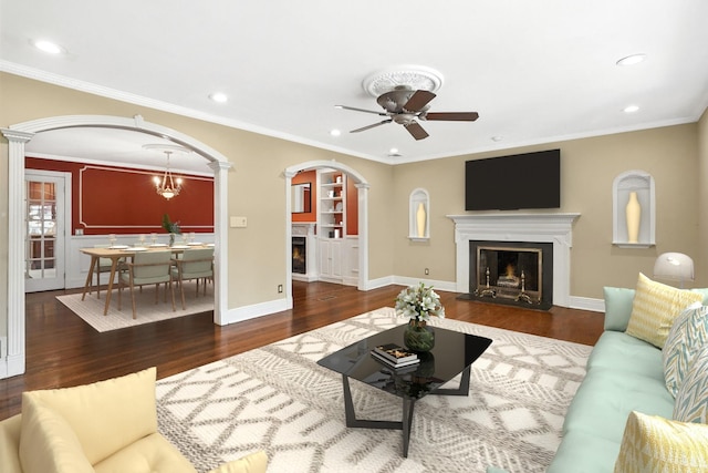 2 Ann Pl, Valhalla, NY 10595 - living area with a fireplace, wood finished floors, a ceiling fan, arched walkways, and recessed lighting