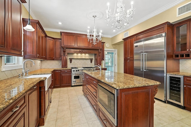2 Ann Pl, Valhalla, NY 10595 - kitchen featuring wine cooler, built in appliances, a chandelier, tasteful backsplash, and light tile patterned floors