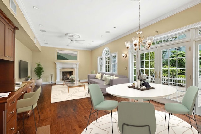 2 Ann Pl, Valhalla, NY 10595 - dining space featuring hardwood / wood-style flooring, crown molding, a fireplace, a chandelier, and recessed lighting