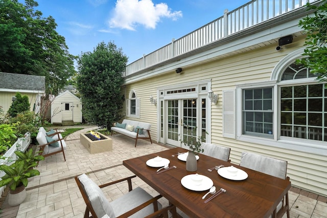 2 Ann Pl, Valhalla, NY 10595 - view of patio featuring a storage shed, outdoor dining area, french doors, and an outdoor living space