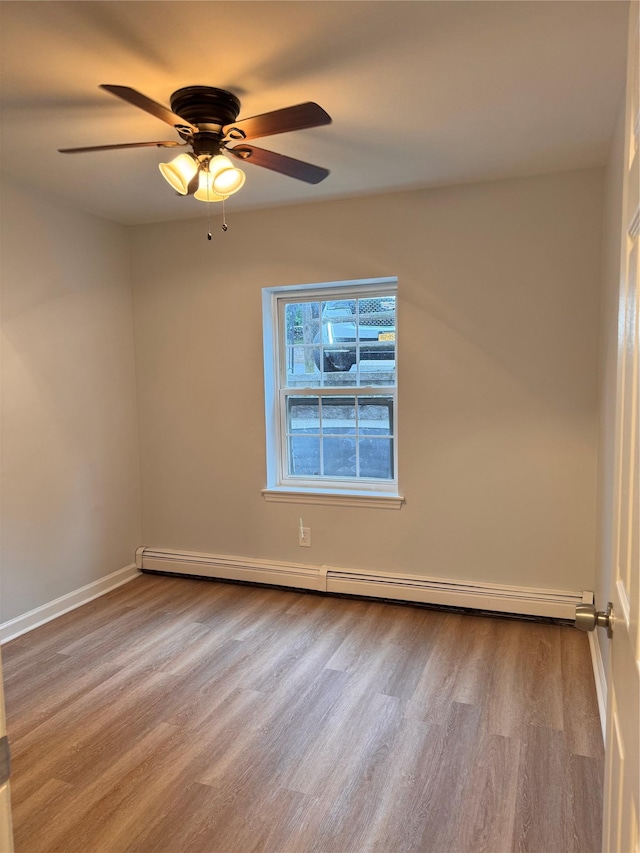21 Lexington Hl Unit 8, Harriman, NY 10926 - unfurnished room featuring wood finished floors, a baseboard radiator, and ceiling fan