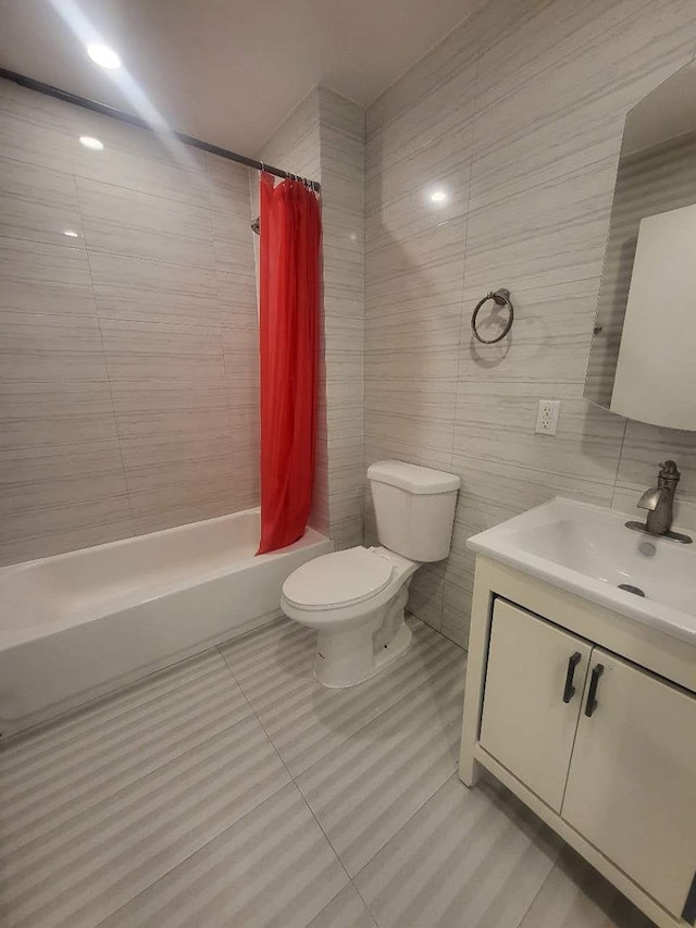 4218 147th St Unit 2E, Flushing, NY 11355 - bathroom with vanity, shower / bath combo with shower curtain, tile walls, and tile patterned floors