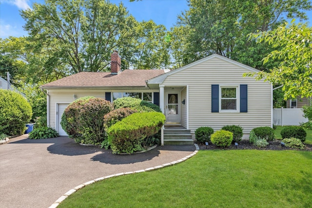 18 Gainsboro Ln, Syosset, NY 11791 - view of front of property with driveway, a garage, a chimney, and roof with shingles