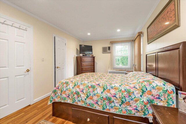 18 Gainsboro Ln, Syosset, NY 11791 - bedroom with ornamental molding, light wood-style flooring, recessed lighting, and a wall mounted AC