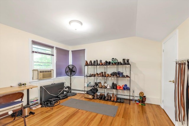 18 Gainsboro Ln, Syosset, NY 11791 - workout area featuring wood finished floors, cooling unit, and vaulted ceiling